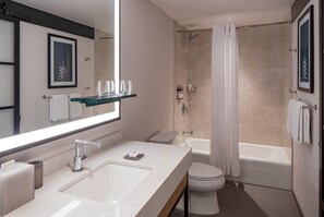 Combined shower/tub, designer toiletries, hair dryer, towels