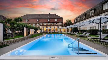 Indoor pool, outdoor pool, open 7:00 AM to 10:00 PM, sun loungers