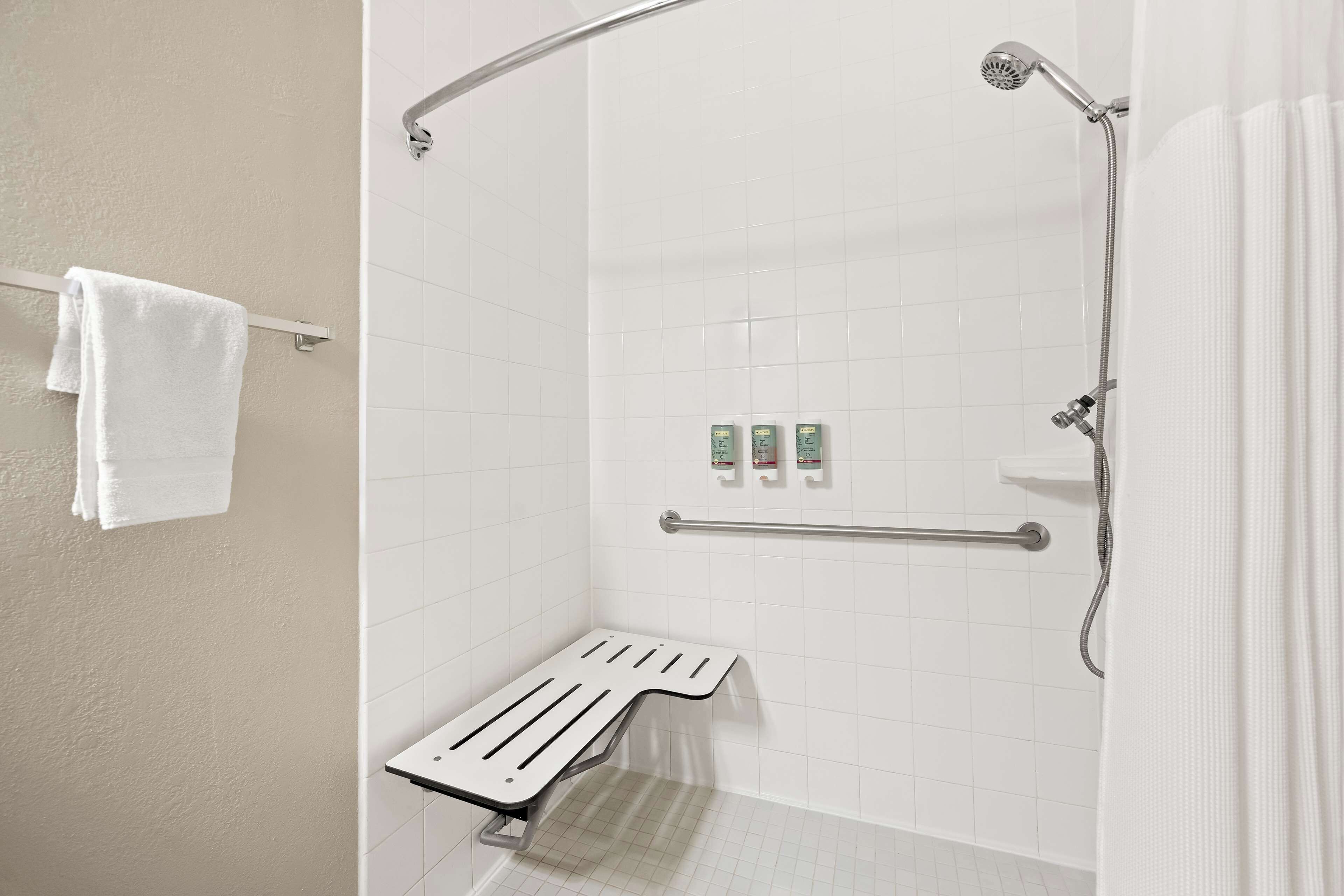 suite, 1 king bed, accessible, refrigerator & microwave (with sofabed) | bathroom | combined shower/bathtub, free toiletries, hair dryer, towels