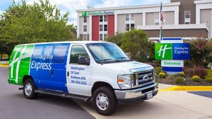 A Holiday Inn Express van parked in front of the hotel. - Holiday Inn Express Washington DC East - Andrews AFB by IHG (Suitland)