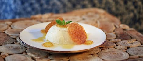 A dessert on a plate with a wooden background.
