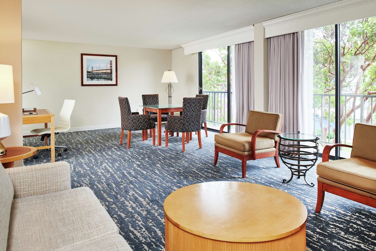 Suite, 1 King Bed | Living area | 49-inch flat-screen TV with cable channels, TV, pay movies