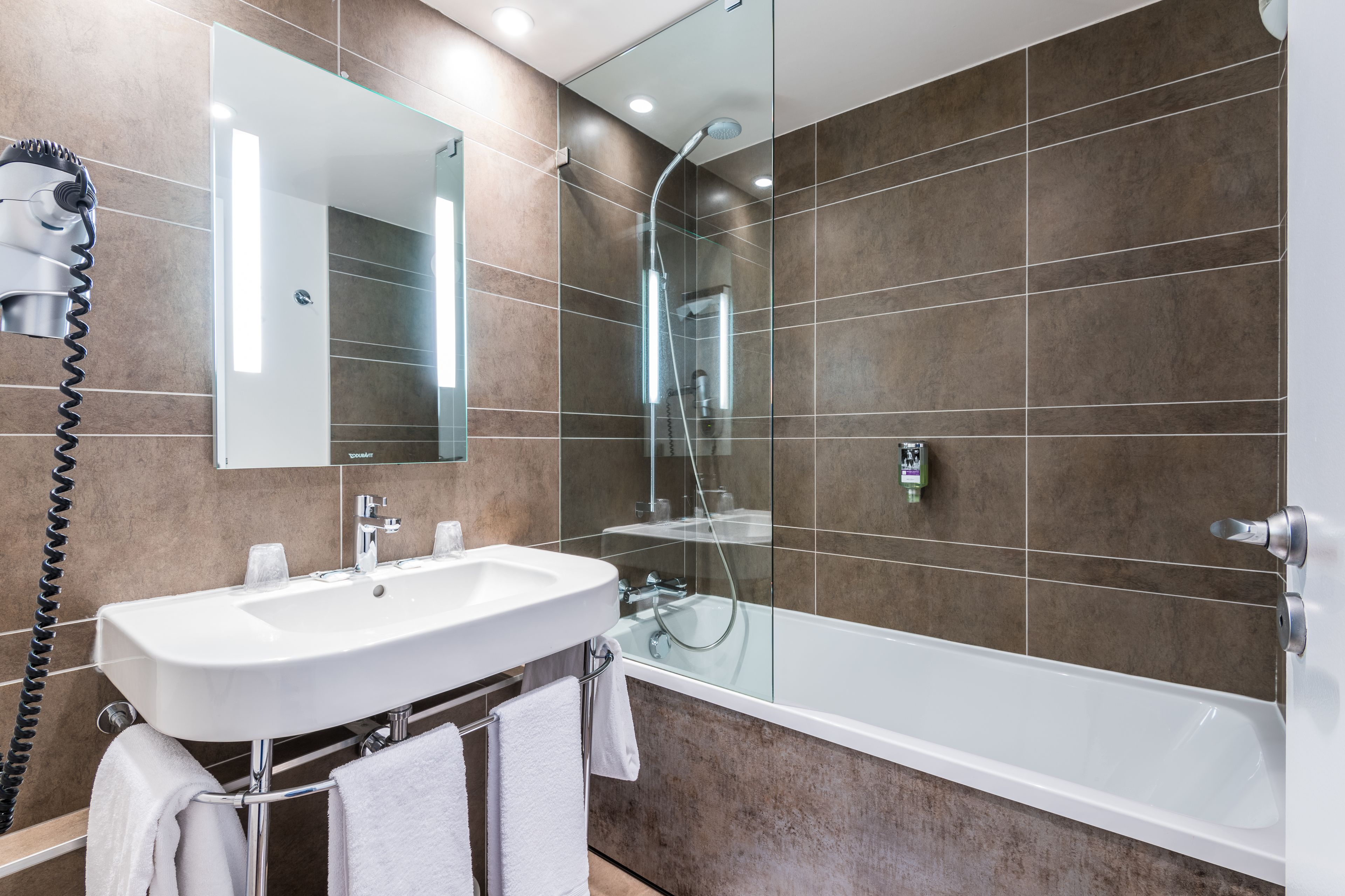 eco-friendly toiletries, hair dryer, towels, soap