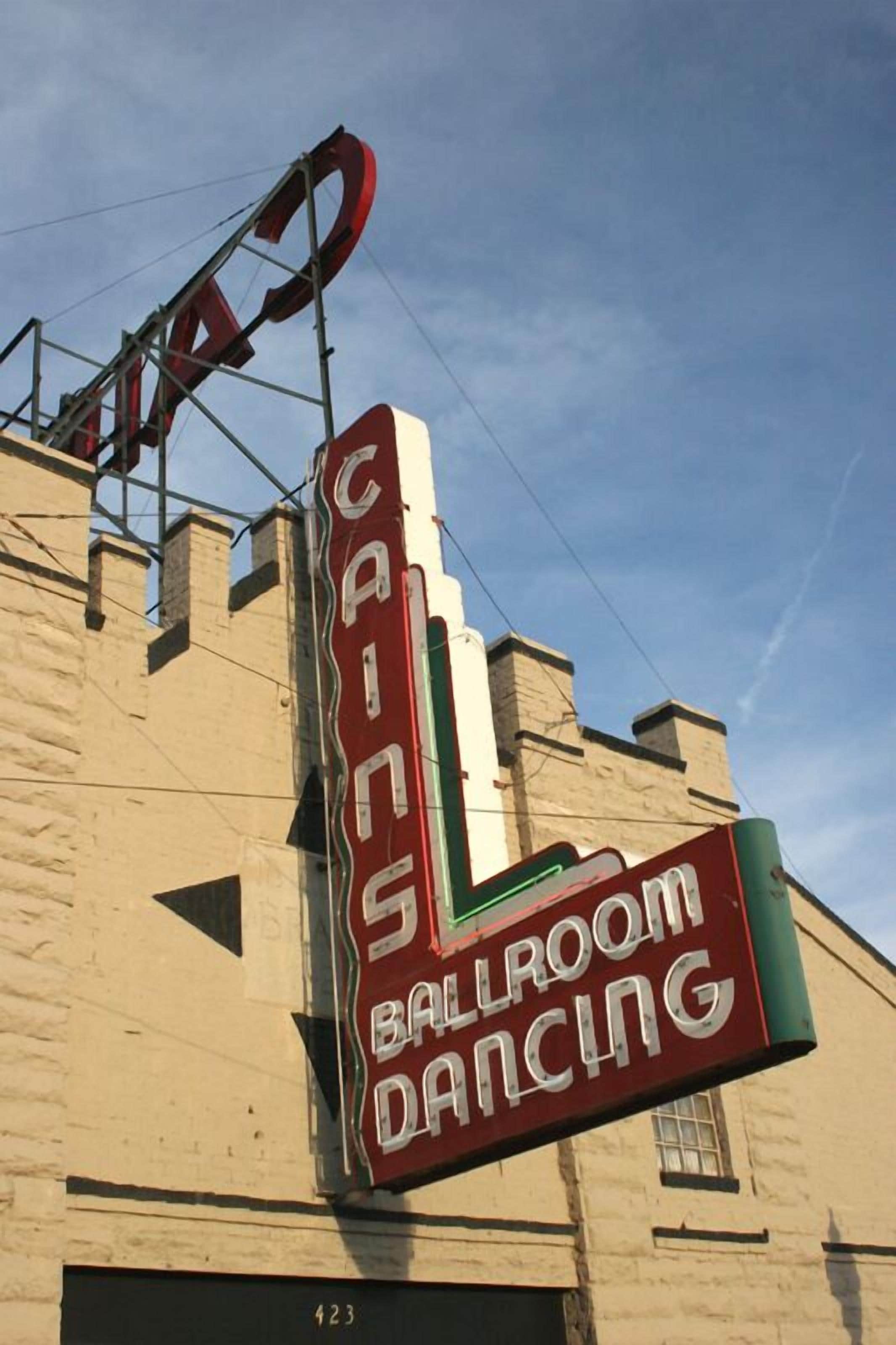 A building with a sign that reads "CINNABBA BALLROOM DANCING."
