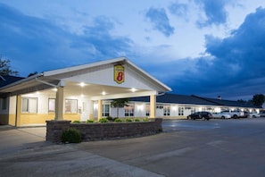 Simple, functional design with a covered parking area and convenient entrance.