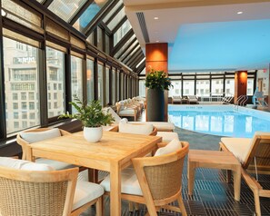 Indoor pool, open 7:00 AM to 7:00 PM, pool loungers