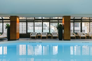 Indoor pool, open 7:00 AM to 7:00 PM, pool loungers