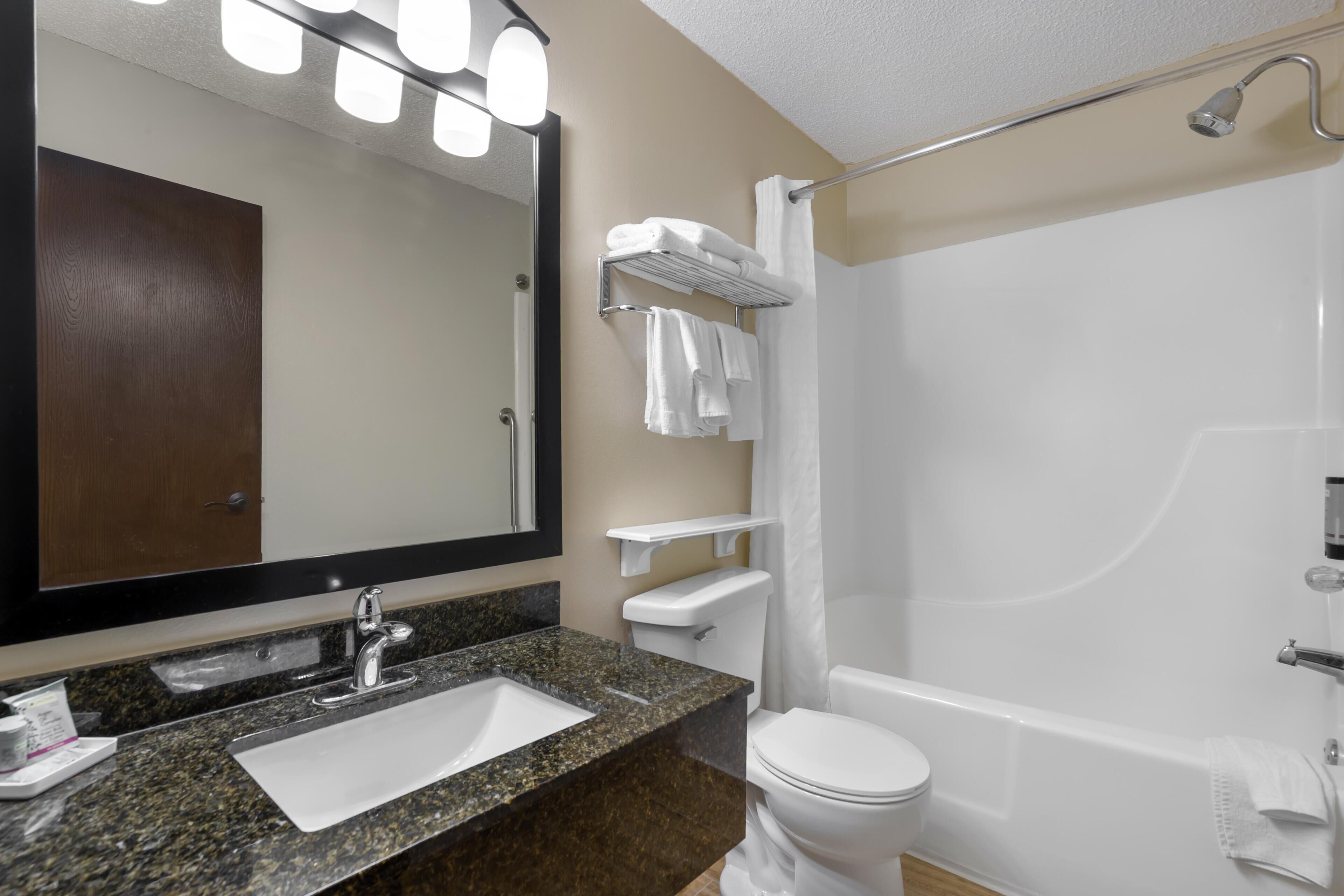 Standard Room, 2 Queen Beds, Non Smoking | Bathroom | Combined shower/tub, free toiletries, hair dryer, towels