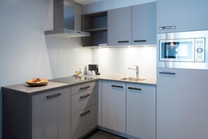 Departamento, 2 camas individuales, cocina | Cocineta privada | Tetera eléctrica y artículos de limpieza ecológicos 