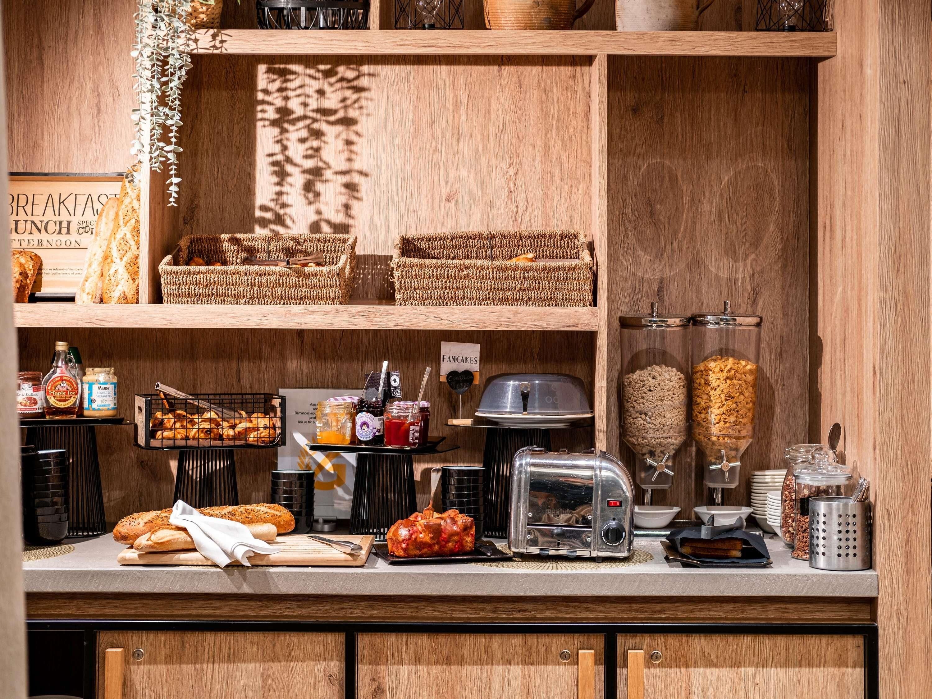 A breakfast buffet with various food items and condiments.