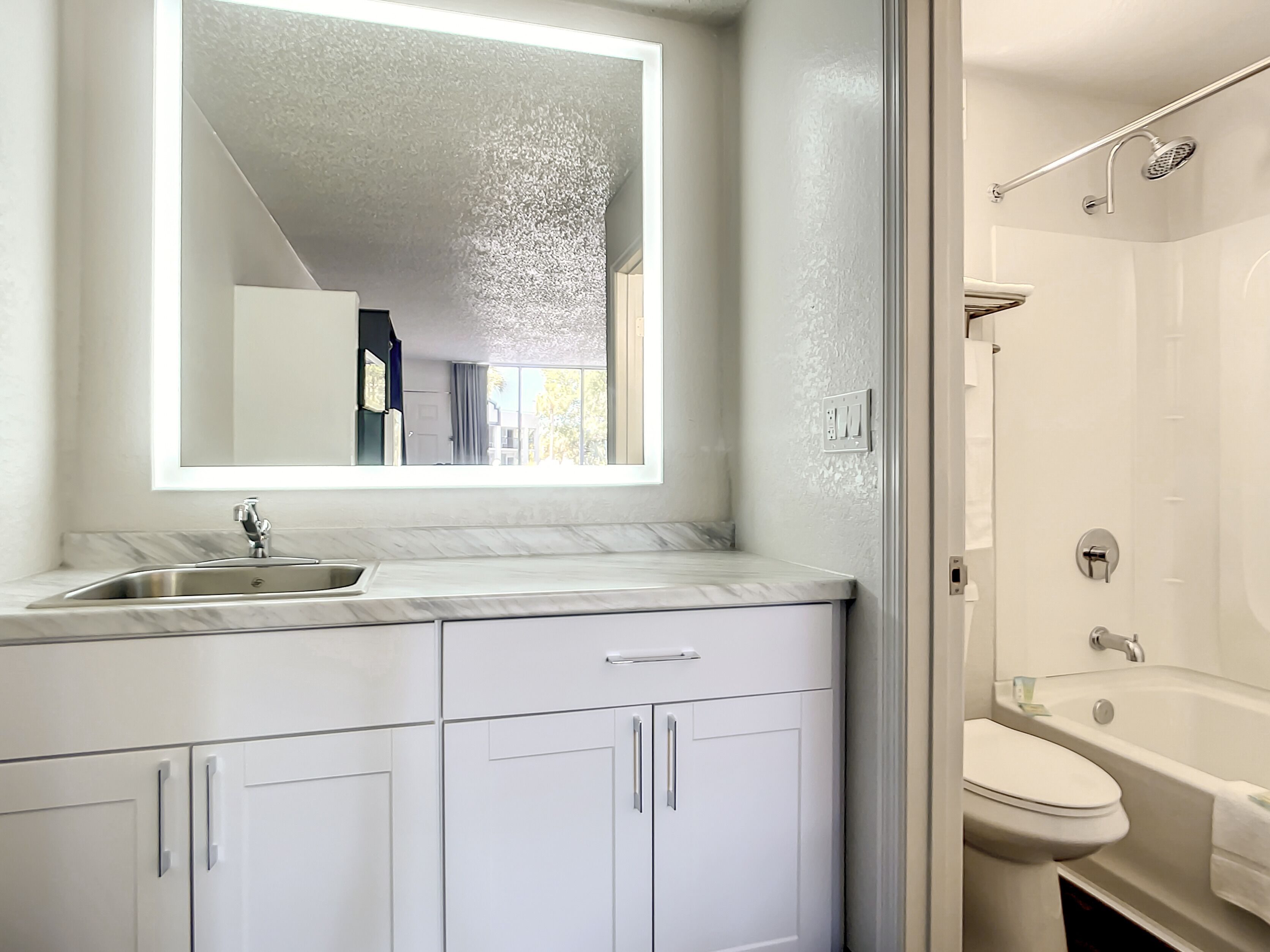 Basic Room, 2 Queen Beds, Non Smoking | Bathroom | Combined shower/bathtub, free toiletries, hair dryer
