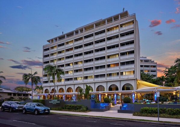 Guests can enjoy balconies and a covered outdoor seating area at this hotel.