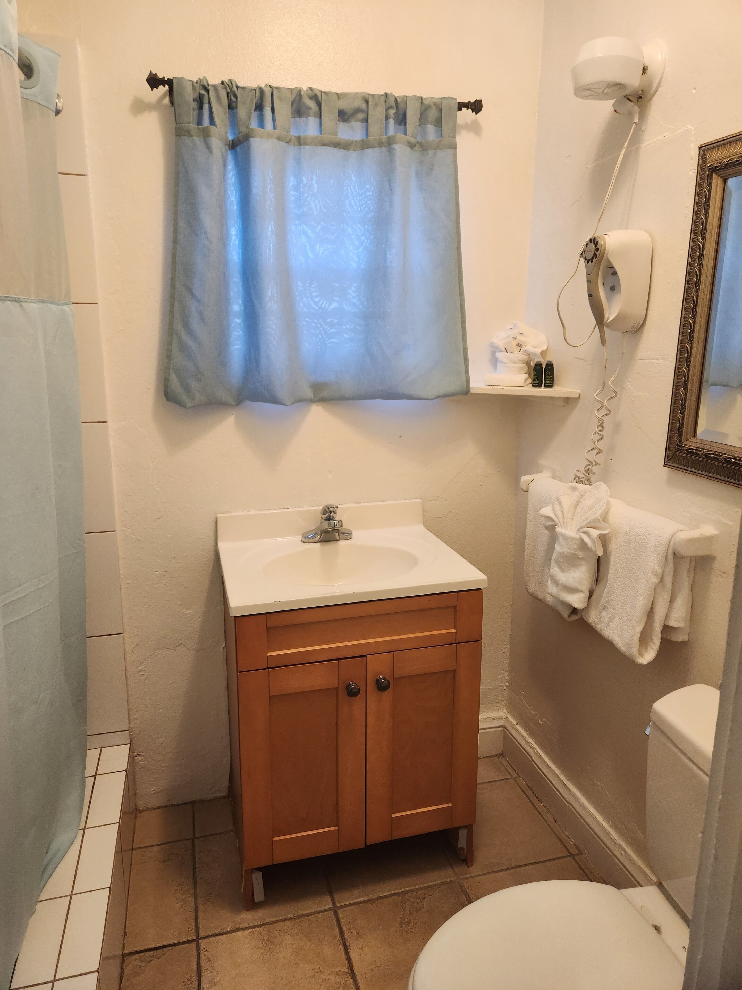 tiny room, full bed | bathroom | shower, hair dryer, towels