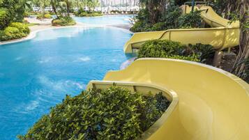 Enjoy a fun and relaxing experience by the pool, where a large water slide awaits.