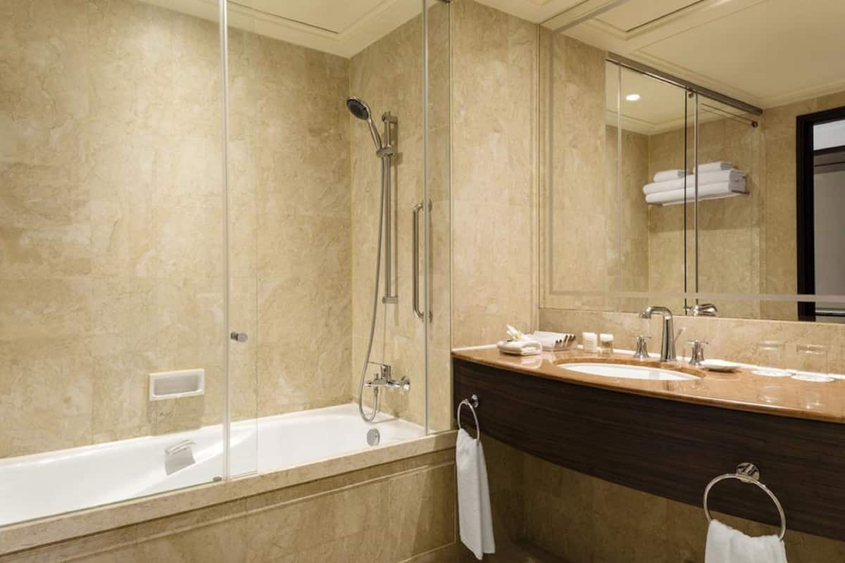 separate bathtub and shower, hair dryer, bathrobes, slippers