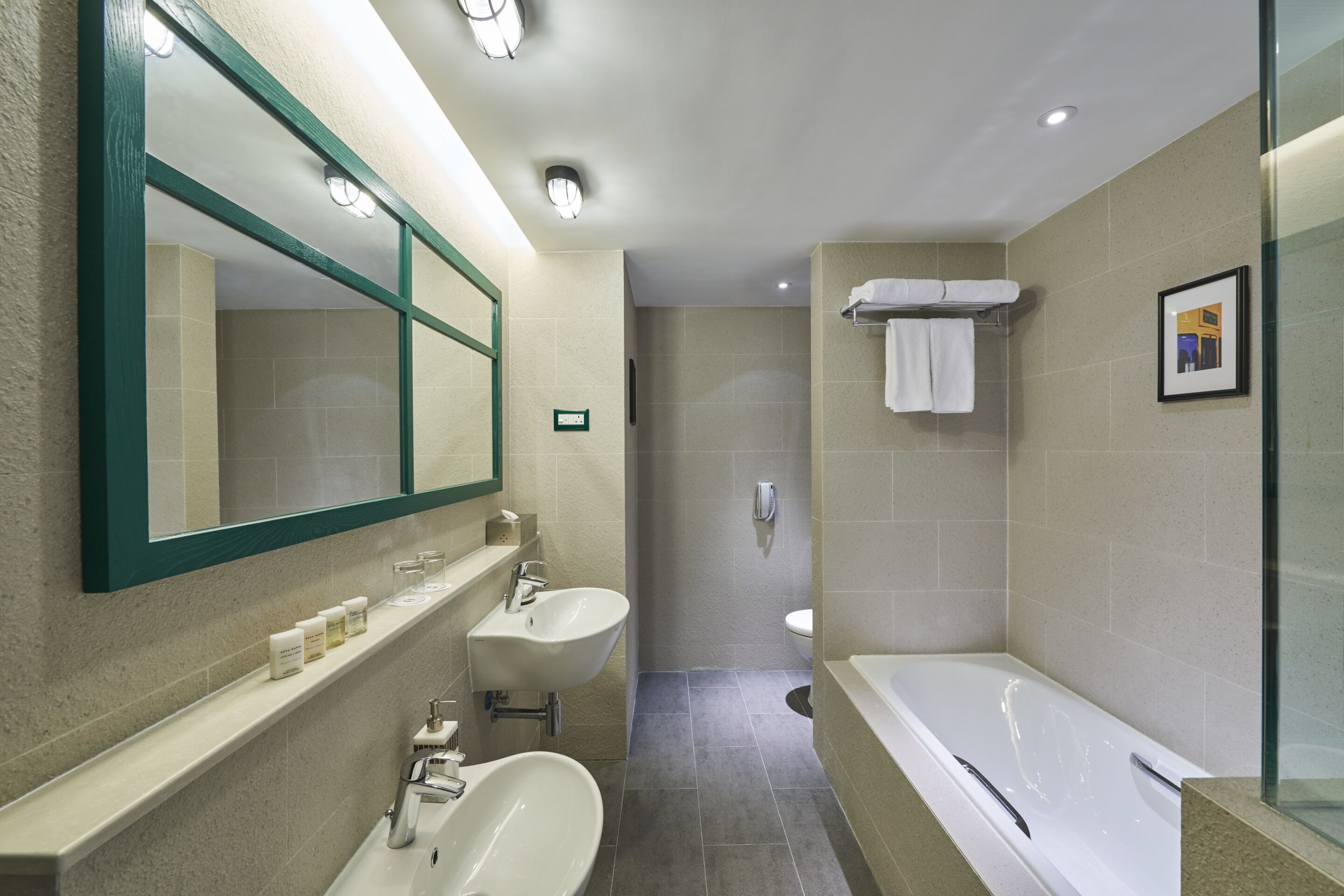 hong kong tram room with sea view balcony | bathroom | separate bathtub and shower, hair dryer, bathrobes, slippers