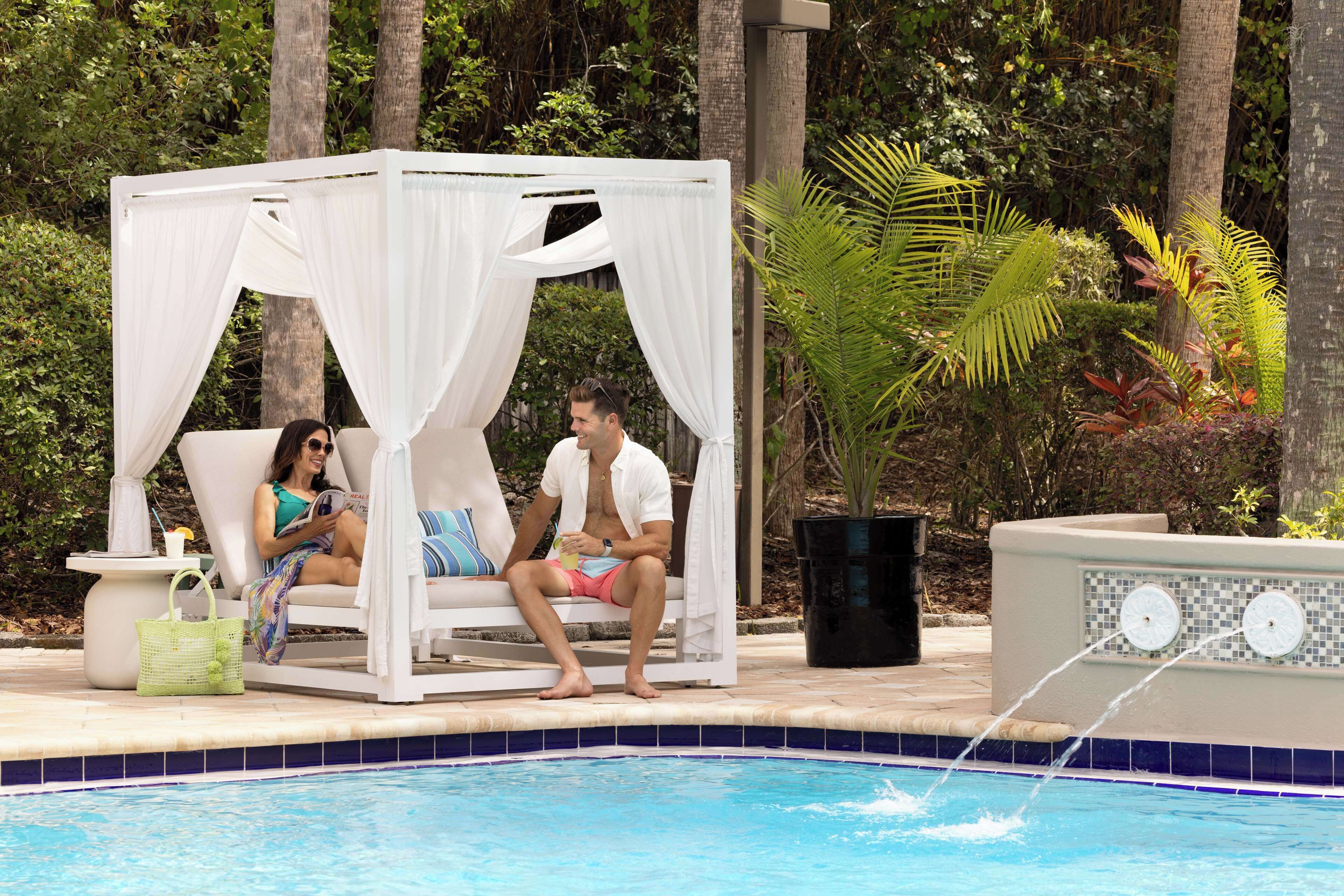 outdoor pool, open 6:00 am to 11:00 pm, pool umbrellas