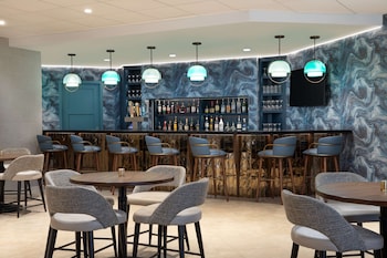 Hotel entrance and lobby at DoubleTree Suites by Hilton Orlando - Disney Springs® Area