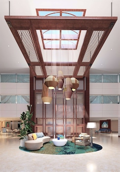 Hotel entrance and lobby at DoubleTree Suites by Hilton Orlando - Disney Springs® Area