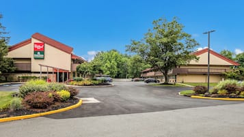 A Red Roof Inn with a parking lot and landscaped areas.