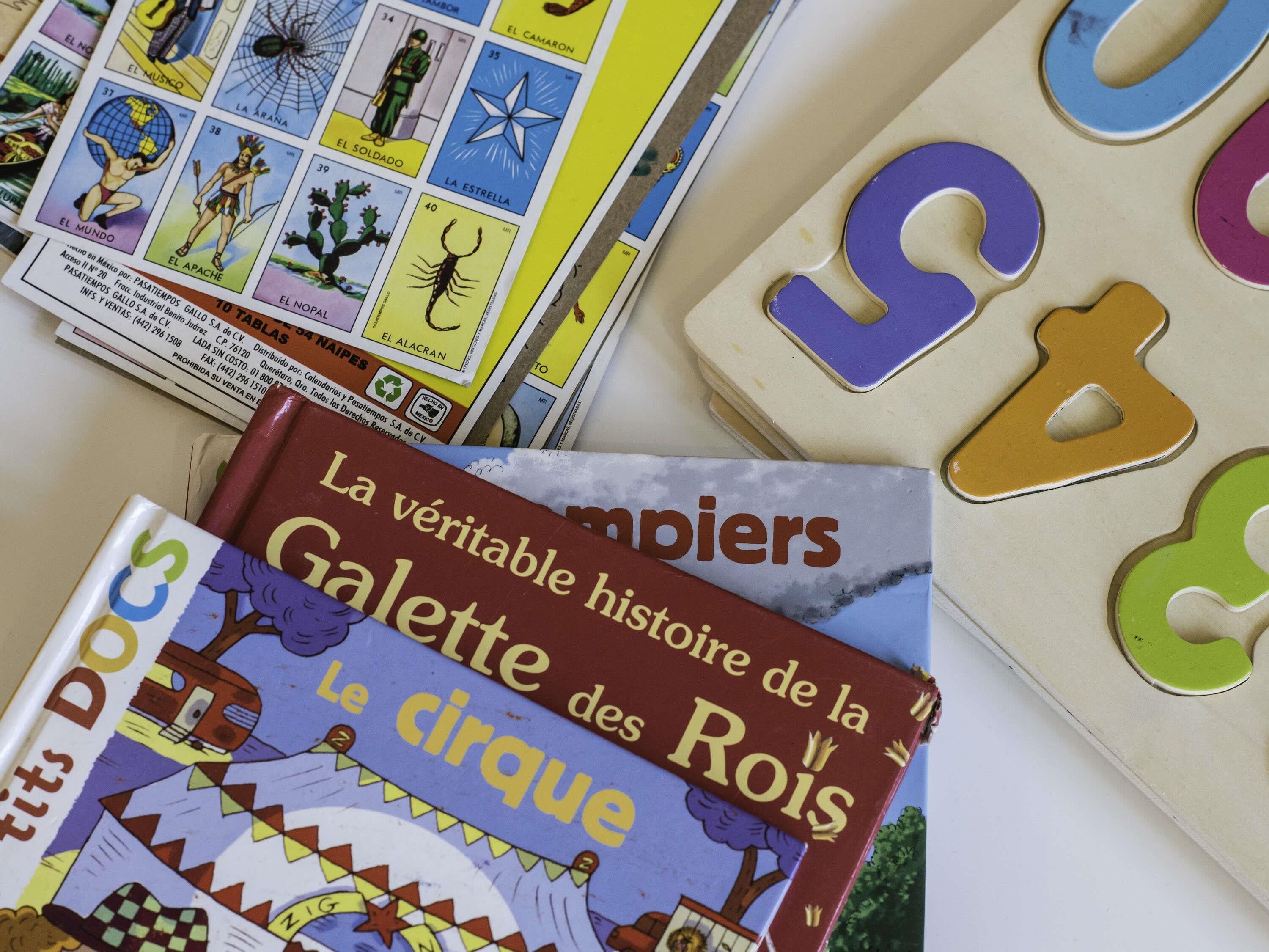 A collection of books and puzzle pieces.