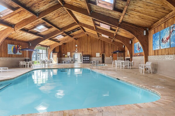 Indoor pool, open 6:00 AM to midnight, pool loungers