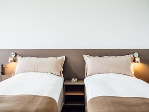 Premium bedding, desk, laptop workspace, blackout curtains