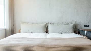 Family Room | Premium bedding, desk, laptop workspace, blackout drapes