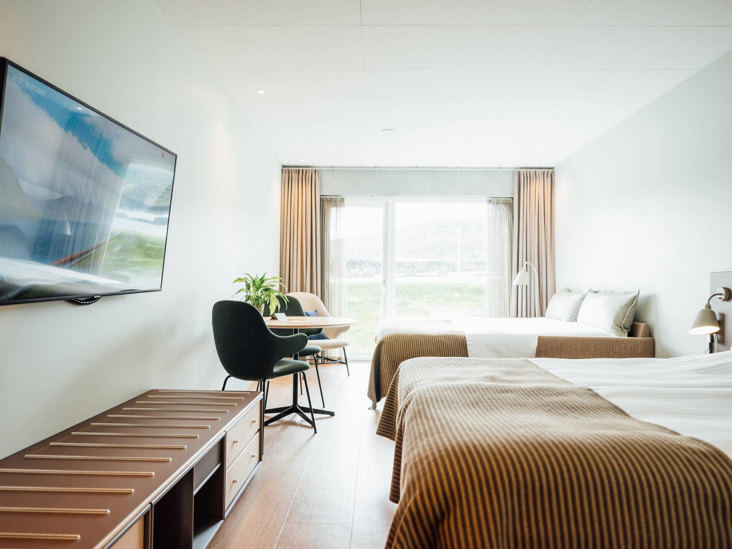 Studio | Premium bedding, desk, laptop workspace, blackout drapes