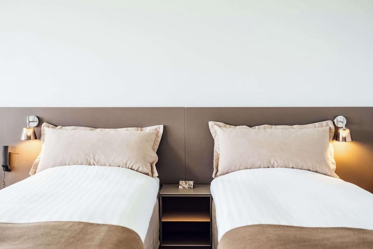 premium bedding, desk, laptop workspace, iron/ironing board