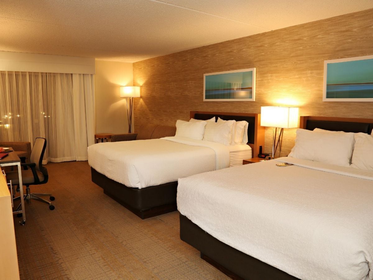 Premium bedding, desk, laptop workspace, blackout curtains