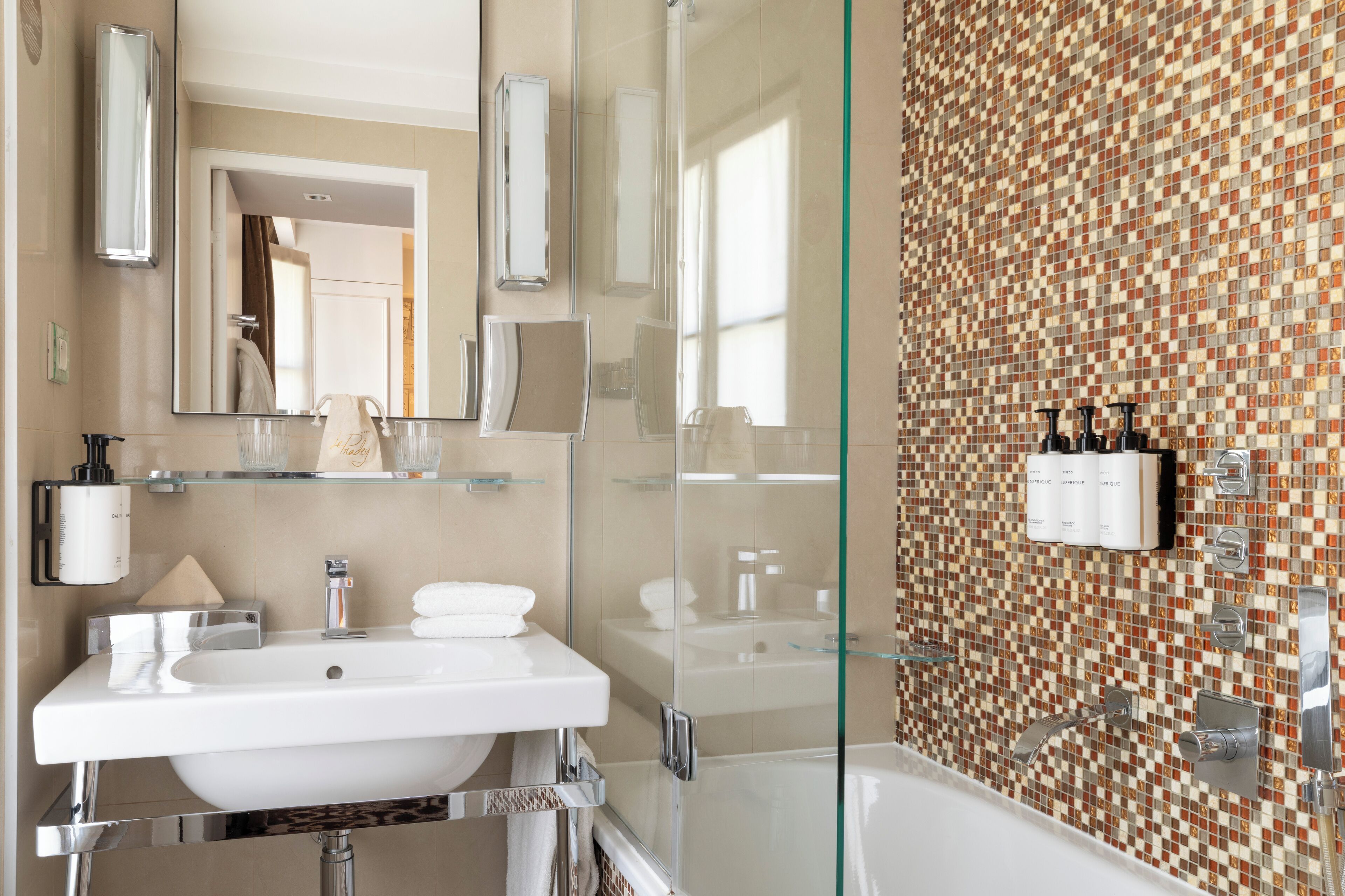 suite, balcony | bathroom | rainfall showerhead, designer toiletries, hair dryer, bathrobes