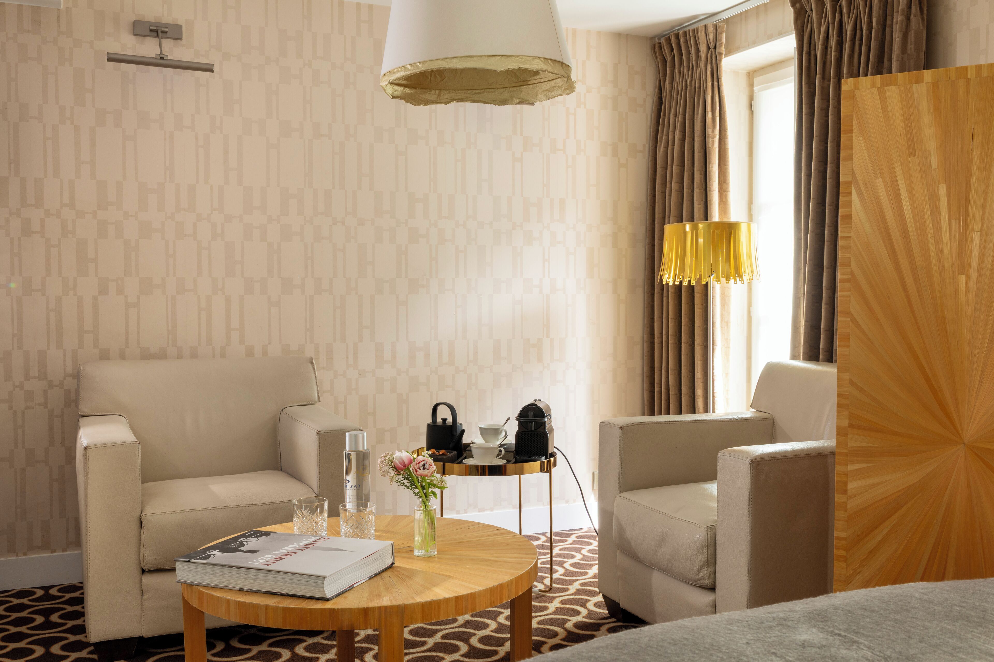 deluxe suite (parisienne) | living area | 82-inch flat-screen tv with satellite channels, tv