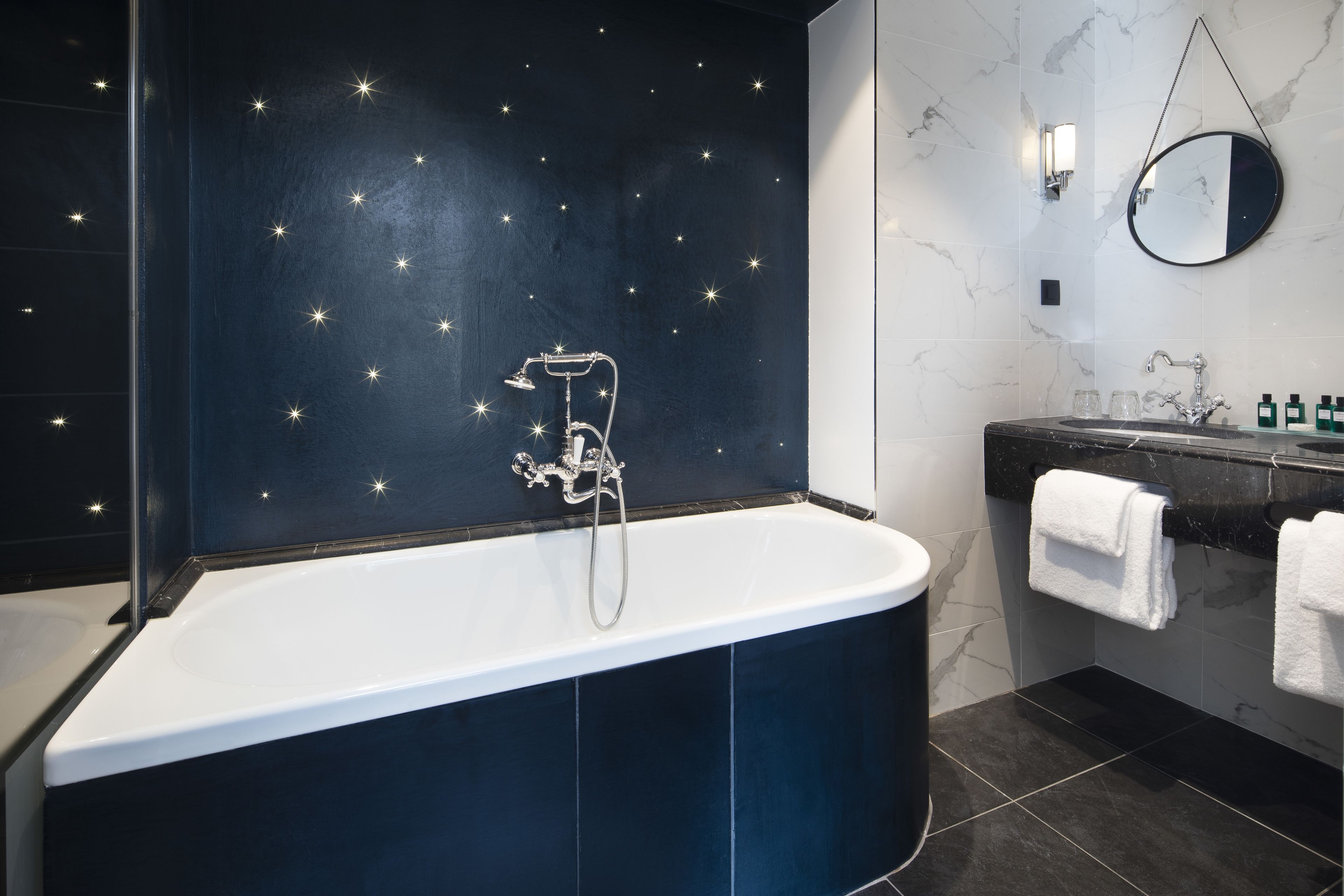 family suite | bathroom | rainfall showerhead, designer toiletries, hair dryer, bathrobes