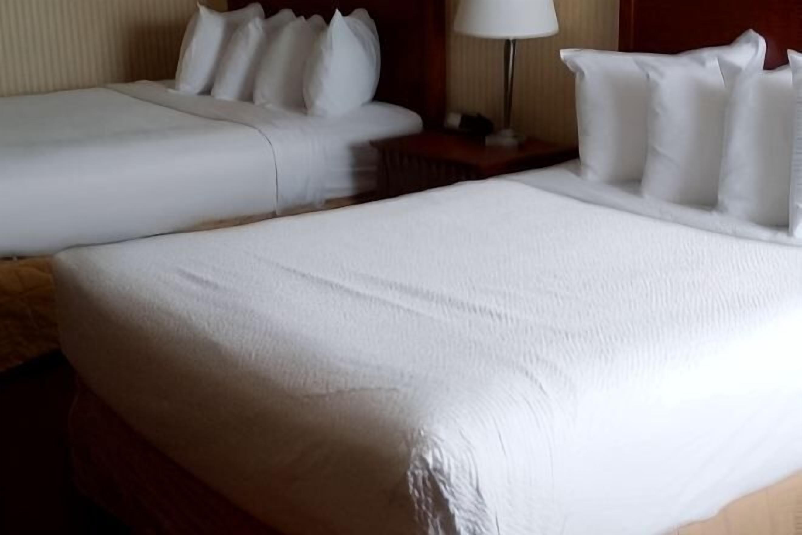 Premium bedding, pillowtop beds, desk, laptop workspace