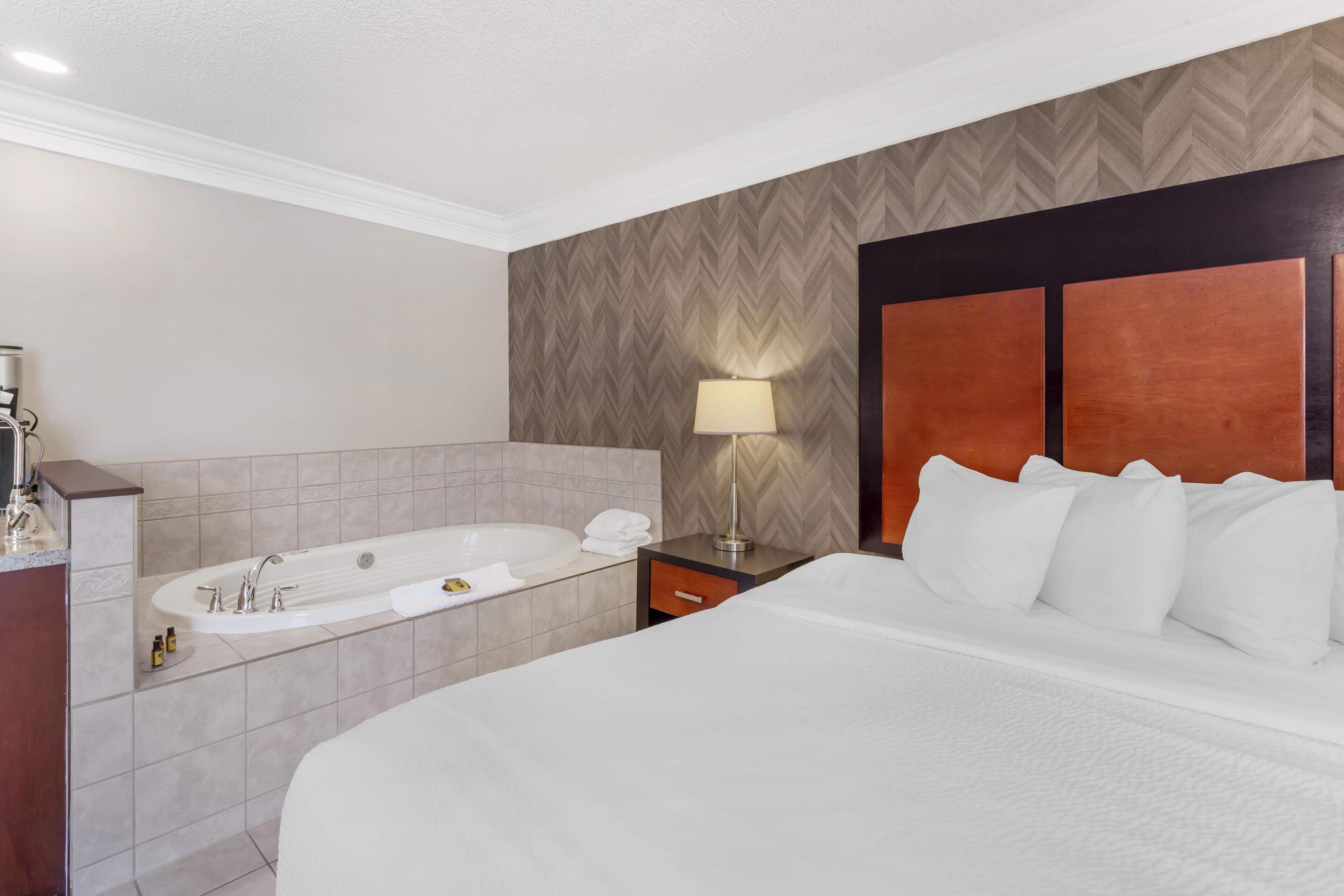 Suite, 1 King Bed, Non Smoking, Jetted Tub | Premium bedding, pillowtop beds, desk, laptop workspace