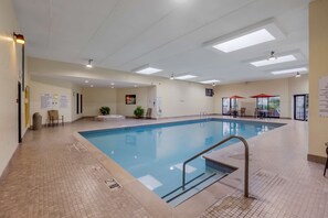 Indoor pool, open 7:00 AM to 11:00 PM, pool umbrellas, sun loungers