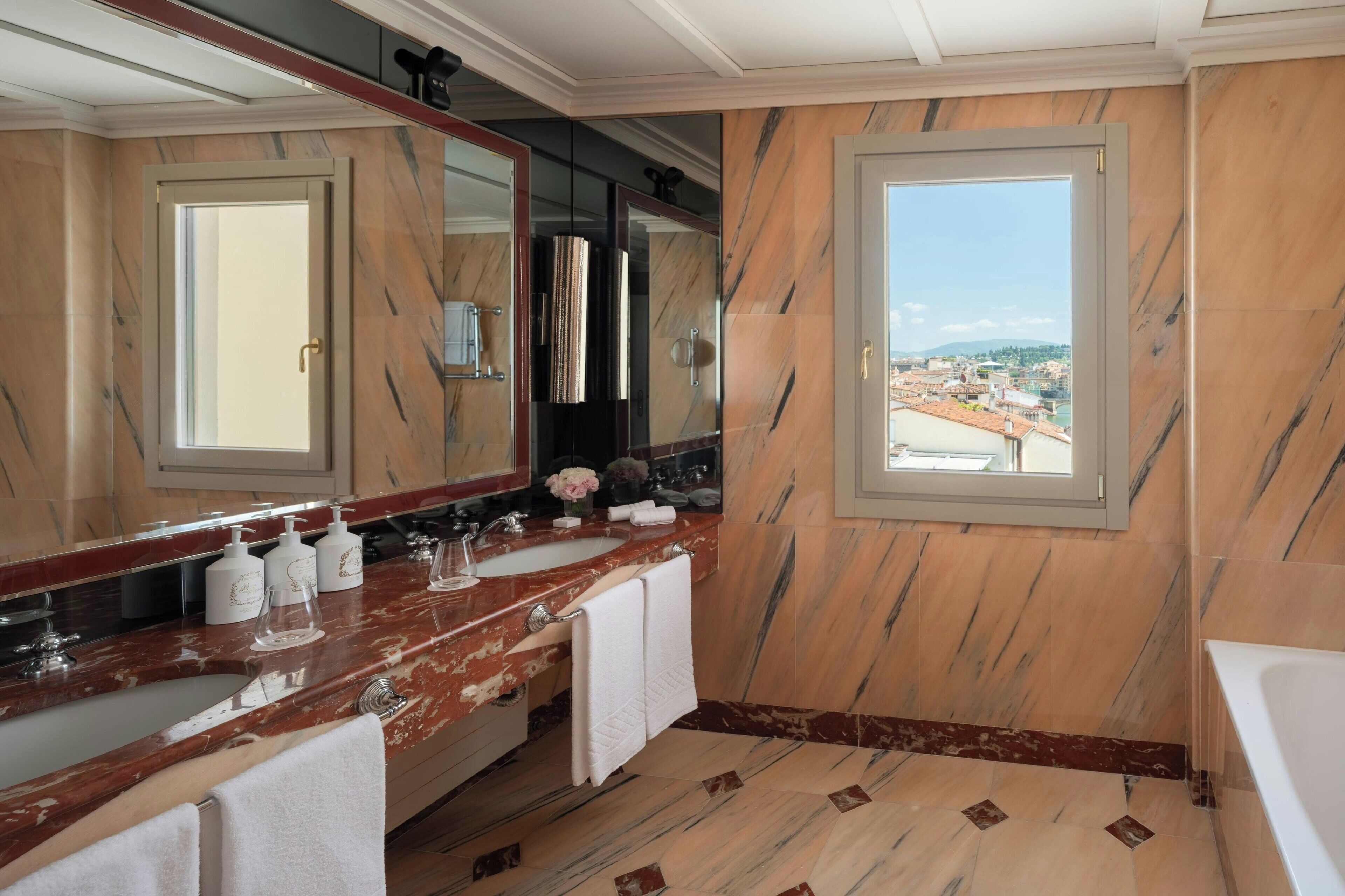 suite, 1 king bed, terrace, river view | bathroom | combined shower/bathtub, free toiletries, hair dryer, bathrobes