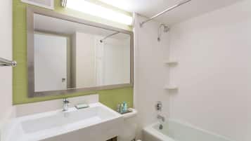 A bathroom with a sink, toilet, and bathtub.