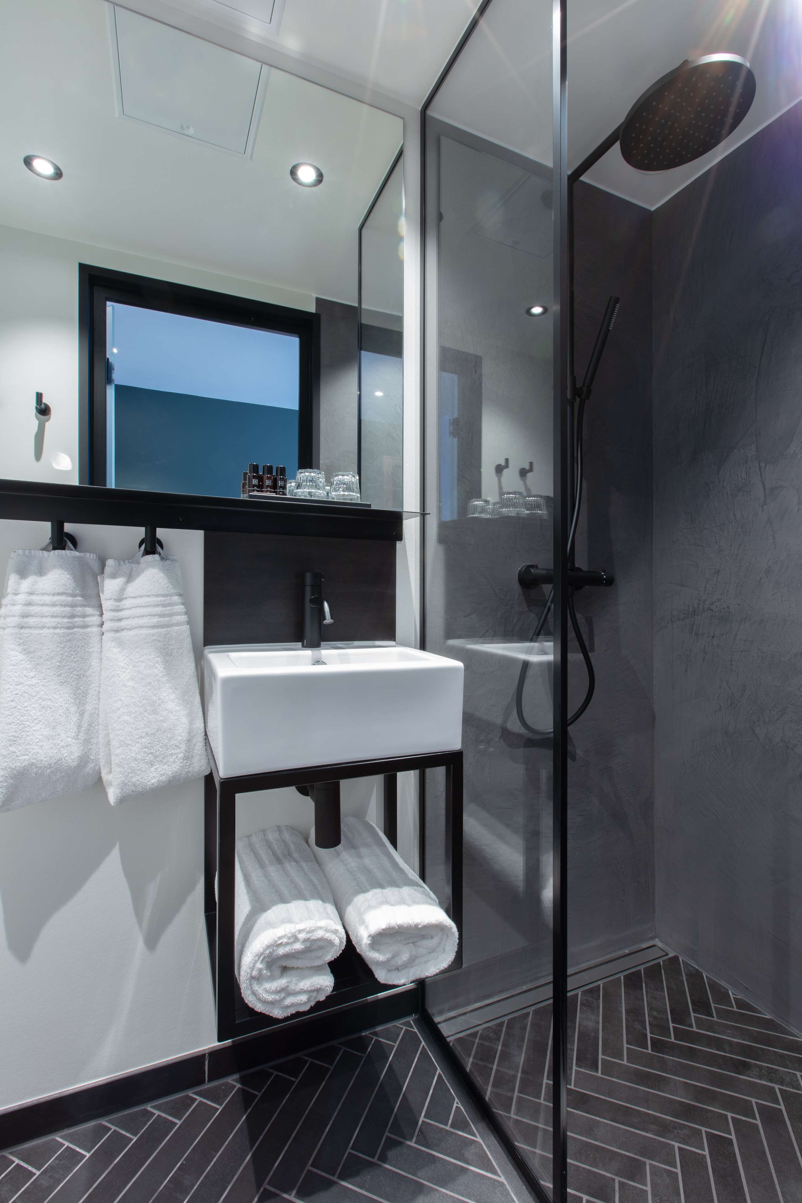 designer toiletries, hair dryer, heated floors, towels