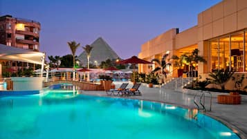 2 outdoor pools, open 8:00 AM to 5:30 PM, pool umbrellas, pool loungers