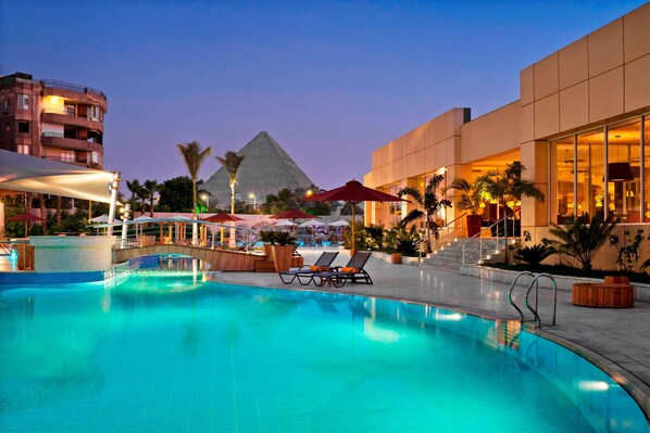 2 outdoor pools, open 8:00 AM to 5:30 PM, pool umbrellas, pool loungers