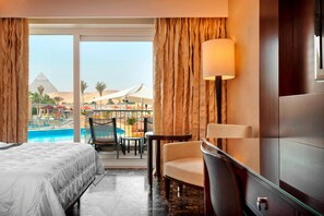 Premium Room, 1 King Bed, Pool View | Pool | 2 outdoor pools, open 8:00 AM to 5:30 PM, pool umbrellas, pool loungers
