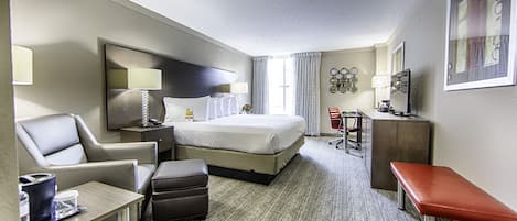 Premium bedding, desk, laptop workspace, blackout drapes