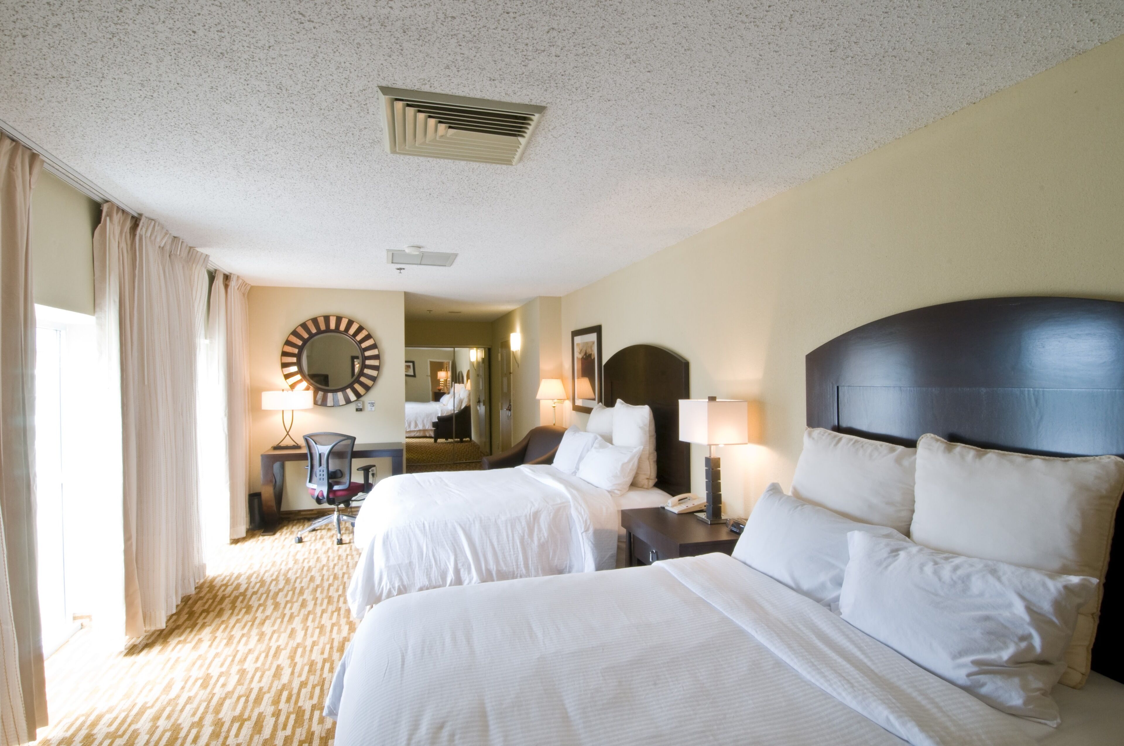 premium bedding, desk, laptop workspace, blackout curtains