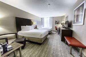 Premium bedding, desk, laptop workspace, blackout drapes