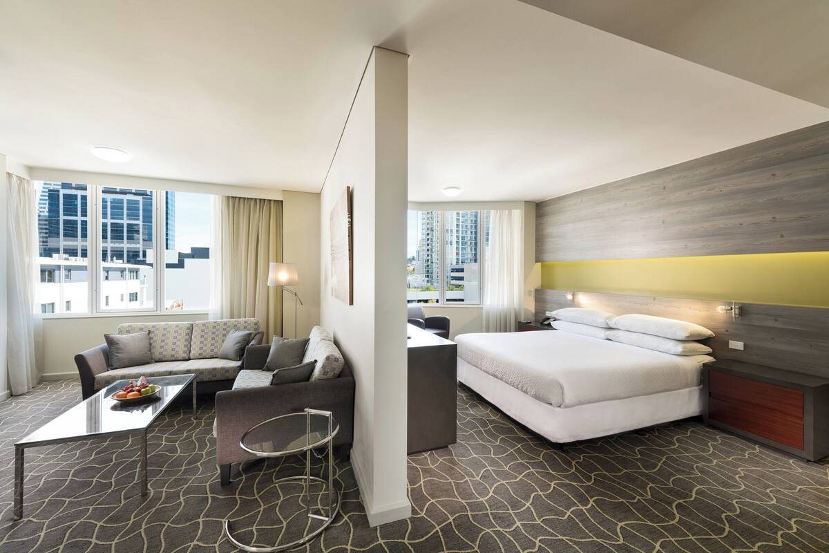 deluxe suite, 1 bedroom, corner | 1 bedroom, in-room safe, desk, laptop workspace
