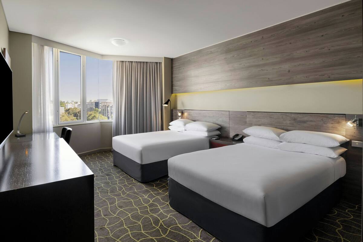 Room, 2 Double Beds | In-room safe, desk, laptop workspace, blackout drapes