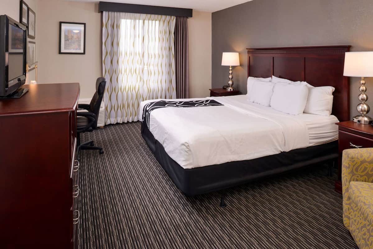 Desk, laptop workspace, blackout drapes, iron/ironing board