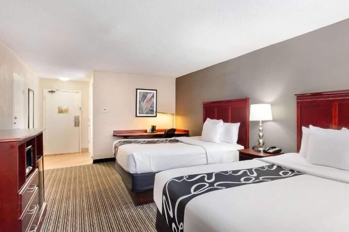 Desk, laptop workspace, blackout drapes, iron/ironing board